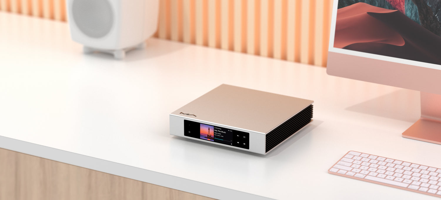 Matrix Audio with desk top and speaker on the desk